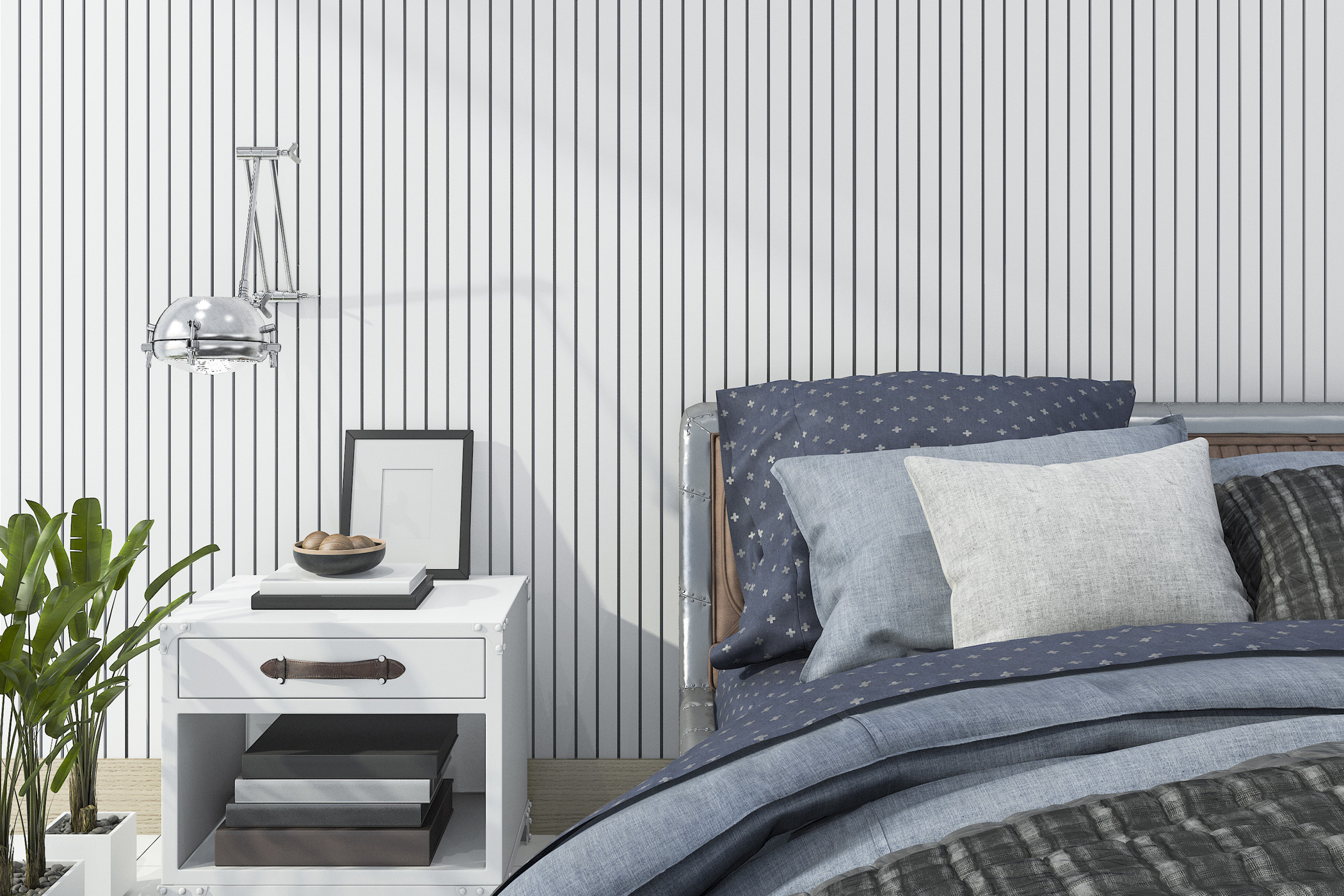 a bed and side table decorated neatly in front of the bold vertical striped wallpaper